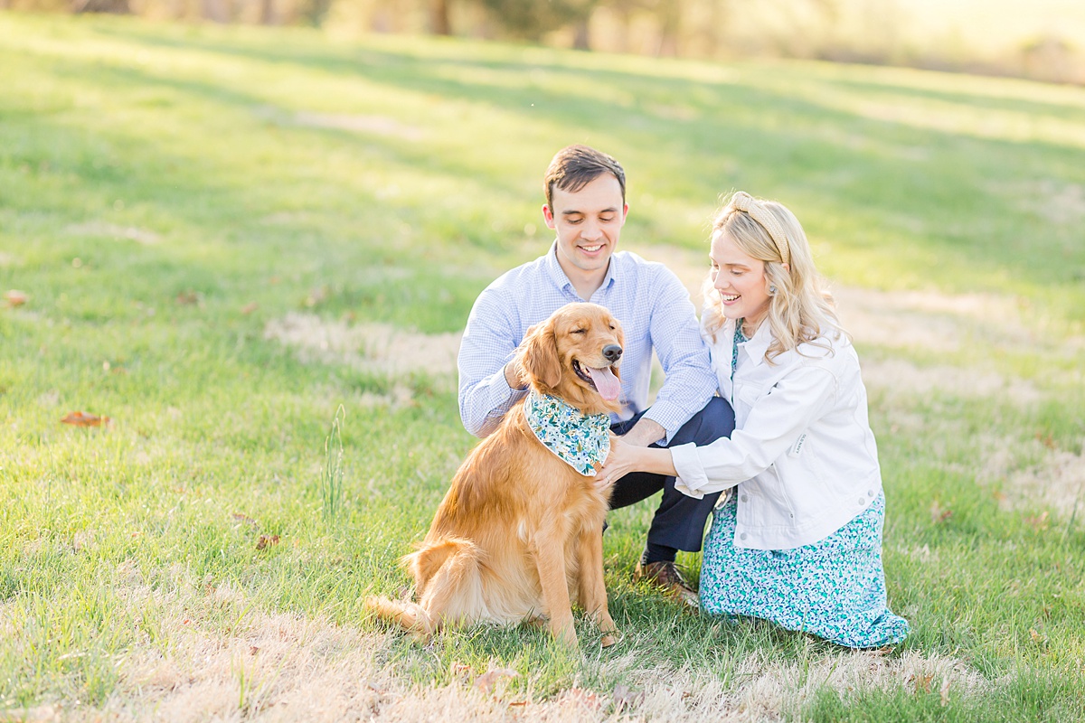 Couple with dog at Summerfield Farms for engagement photos